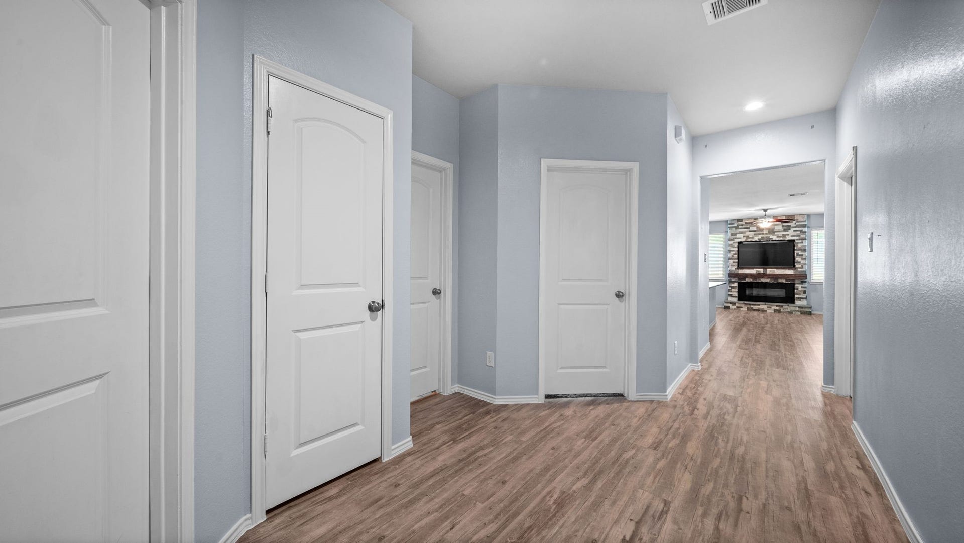 11502 Castle Nugent Court, Conroe, TX 77304 Step inside to a welcoming entryway featuring attractive, easy-care vinyl plank flooring leading into the main living space.