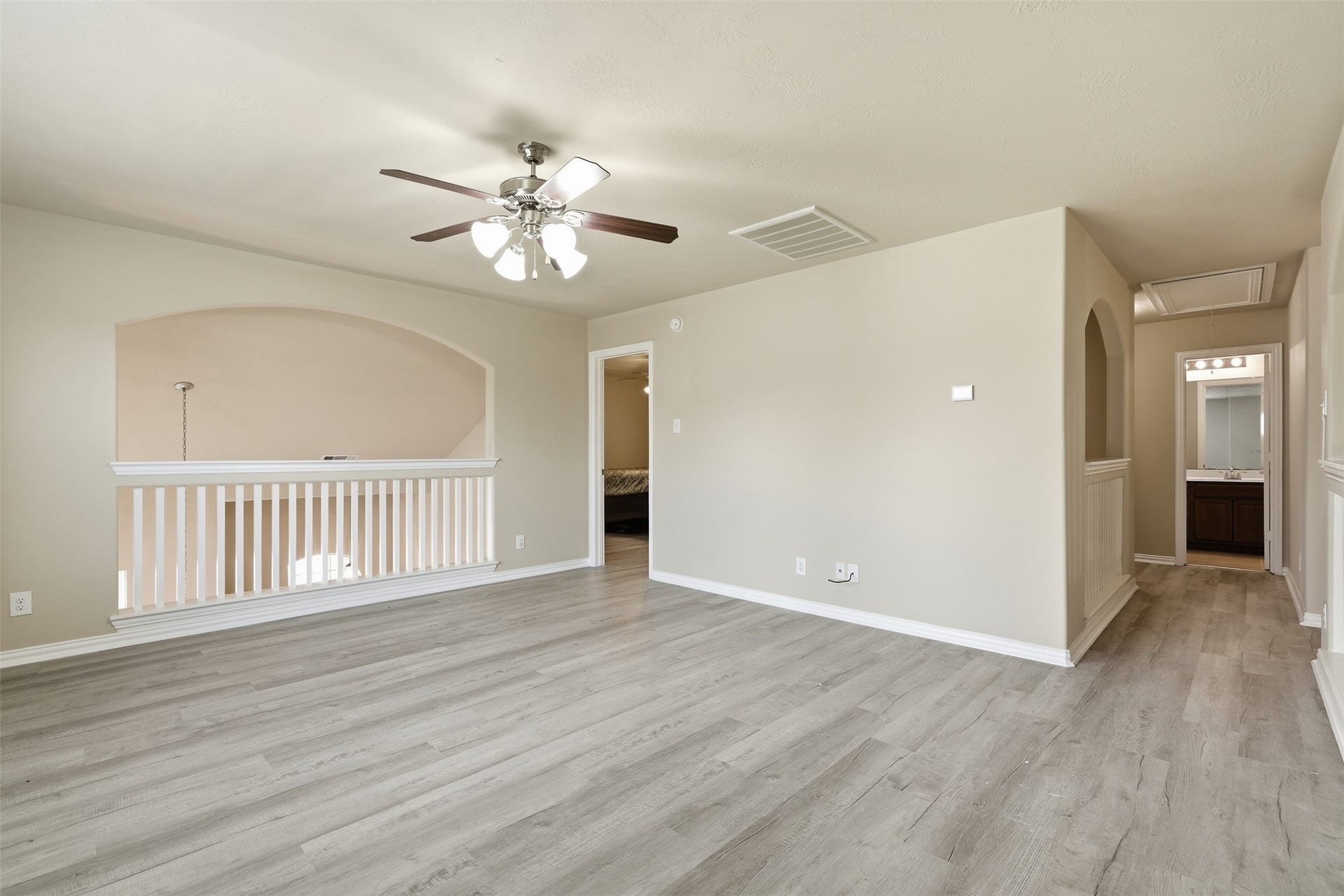 A second look at the game room: an open overlook, easy flow to the upstairs bedrooms and bath, and space to make it the hangout of the house.