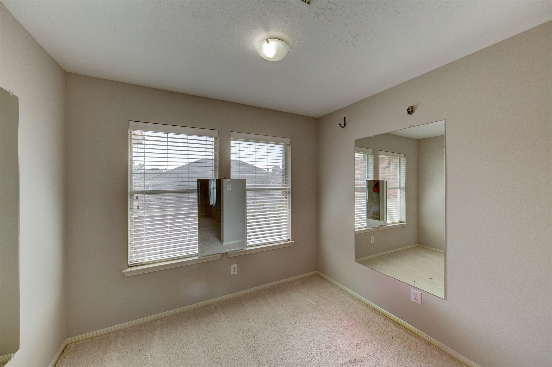 2619 Emerald Springs Court, Pearland, TX 77584 Yoga/flex space with two wall mirrors and third window mirror