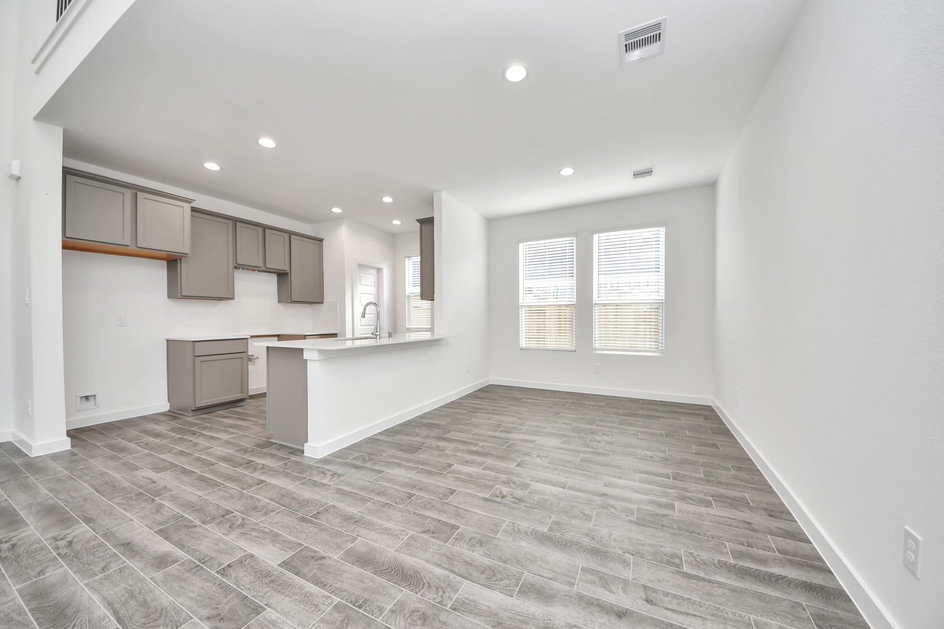 The extended counter area adds both practicality and style, making meal preparation a breeze. Every detail is thoughtfully designed to enhance the kitchen's functionality and aesthetic appeal. Sample photo of completed home with similar floor plan. Actual colors and selections may vary.
