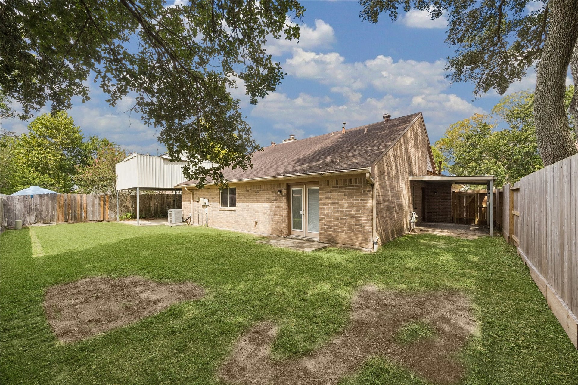 Spacious shaded backyard. Plenty of room for a pool or fabulous landscaping.