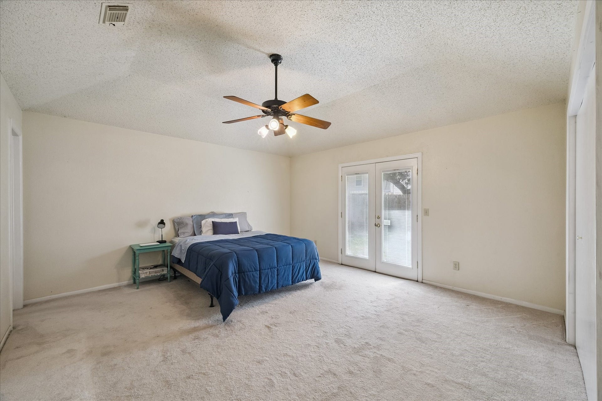 Large Primary Suite with French doors leading to a beautiful backyard. Large closet space and ensuite bath.
