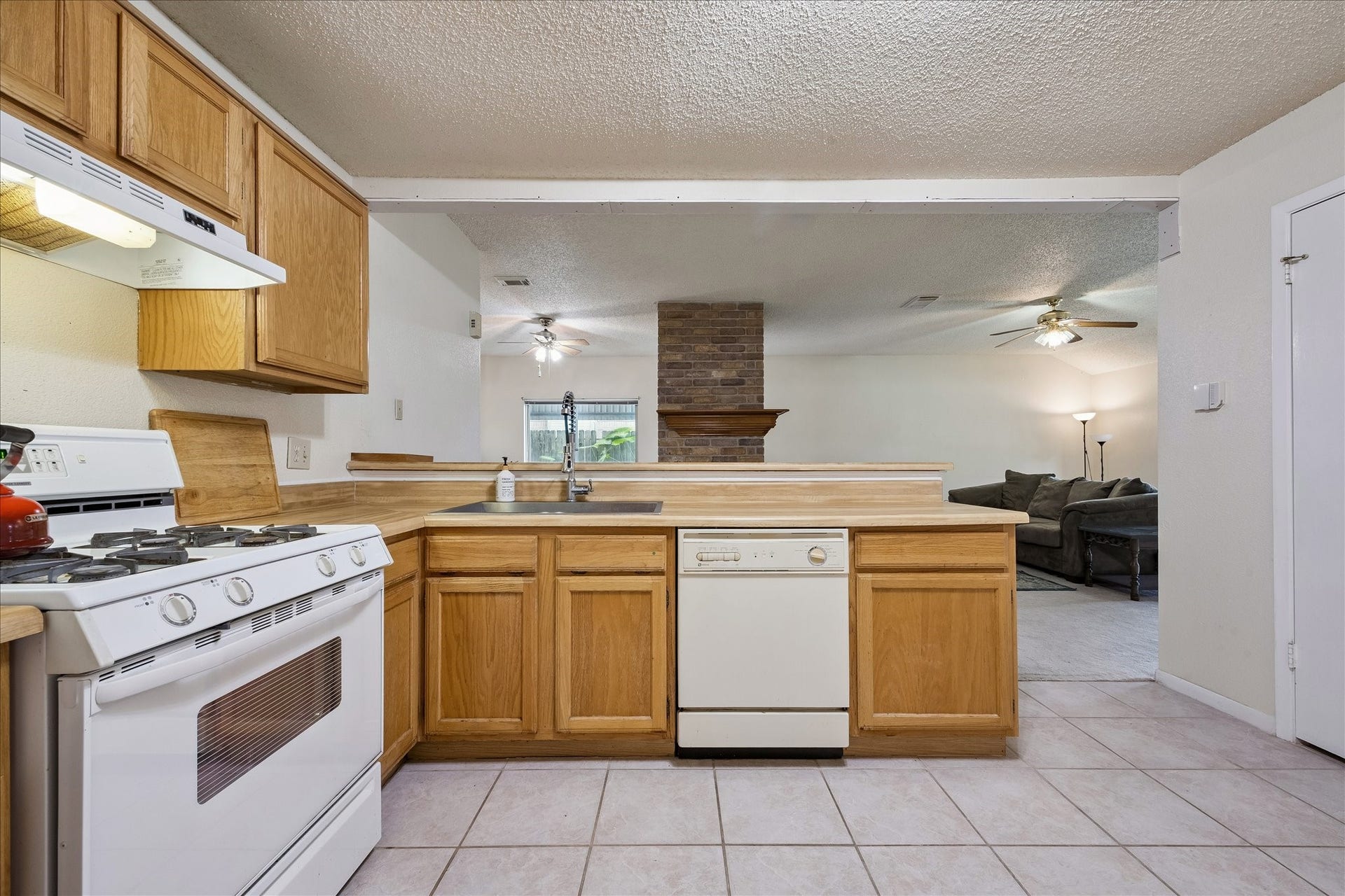 Tile floors and wood cabinets.