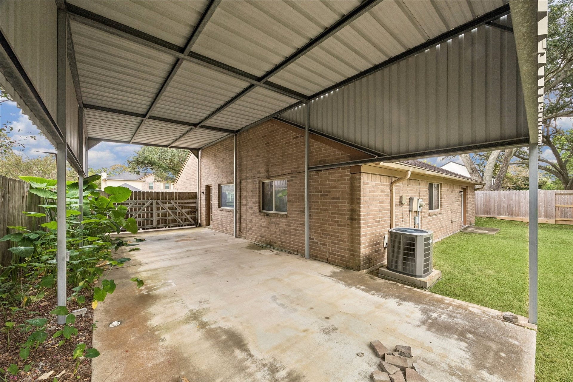 40 ft of covered outdoor space. Built for an RV and equipped with electricity. The space could also be decked out with furniture, big screen TV's , screened in and made into a fabulous outdoor entertainment space.