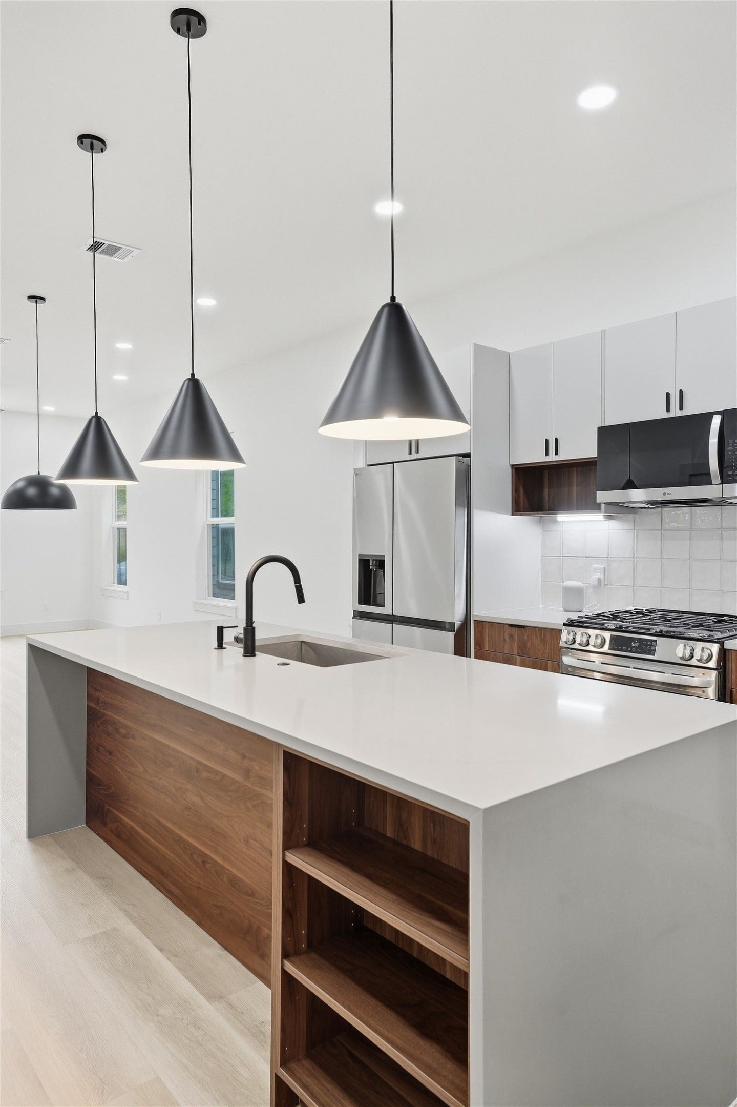 Kitchen with Oversized Waterfall Quartz Island