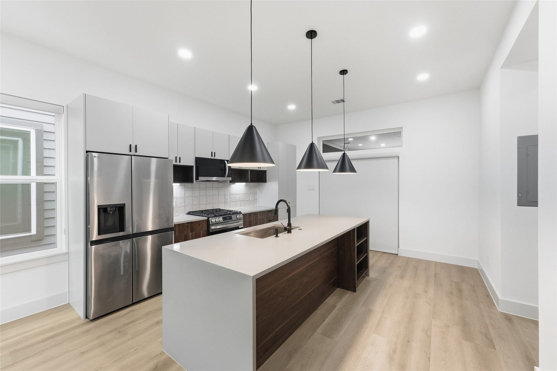 Kitchen with Oversized Waterfall Quartz Island