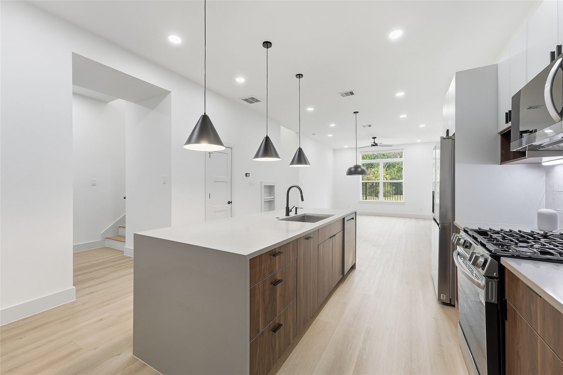 Kitchen with Oversized Waterfall Quartz Island