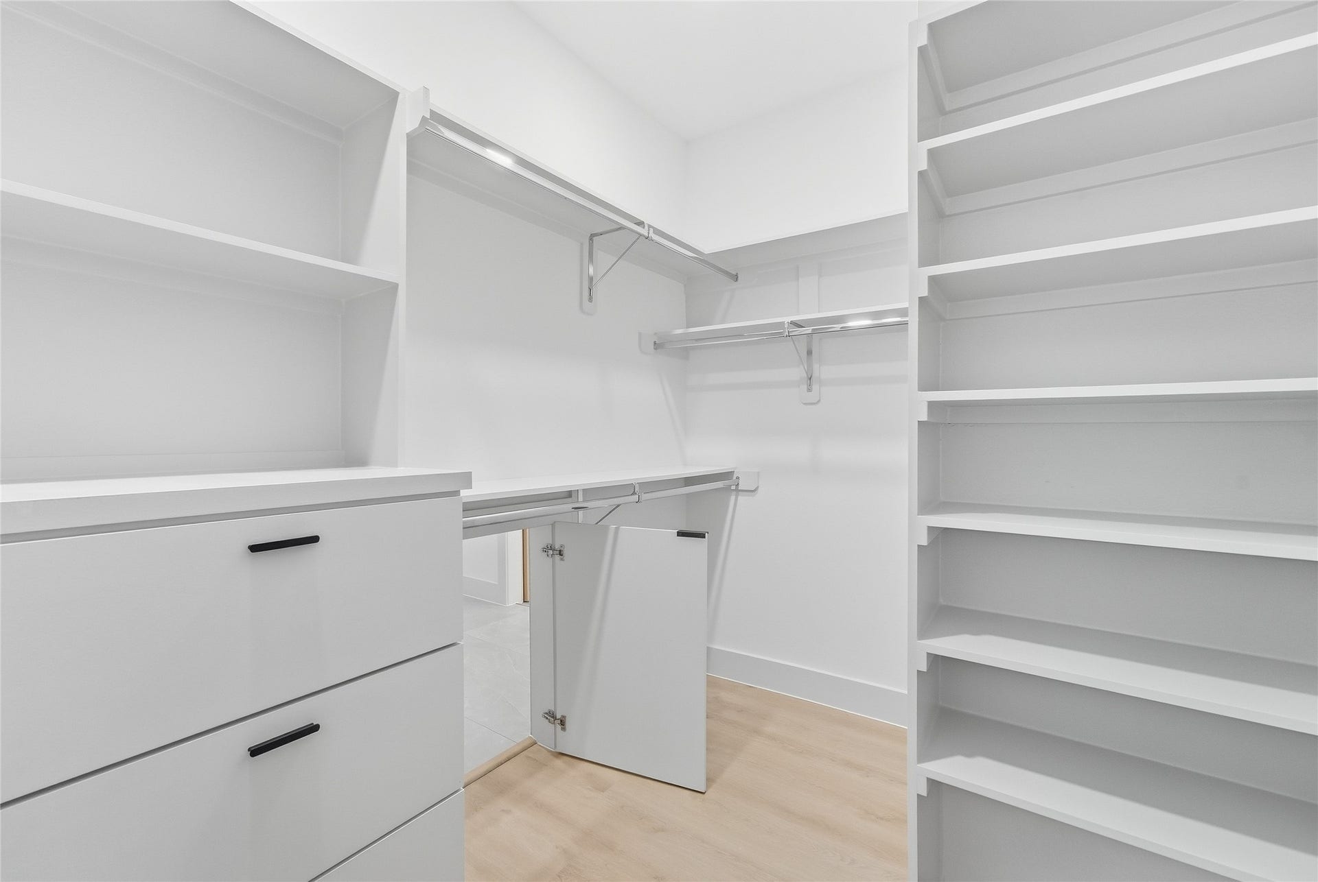 Primary Closet with Laundry Door for Easy Clothing Drop Off