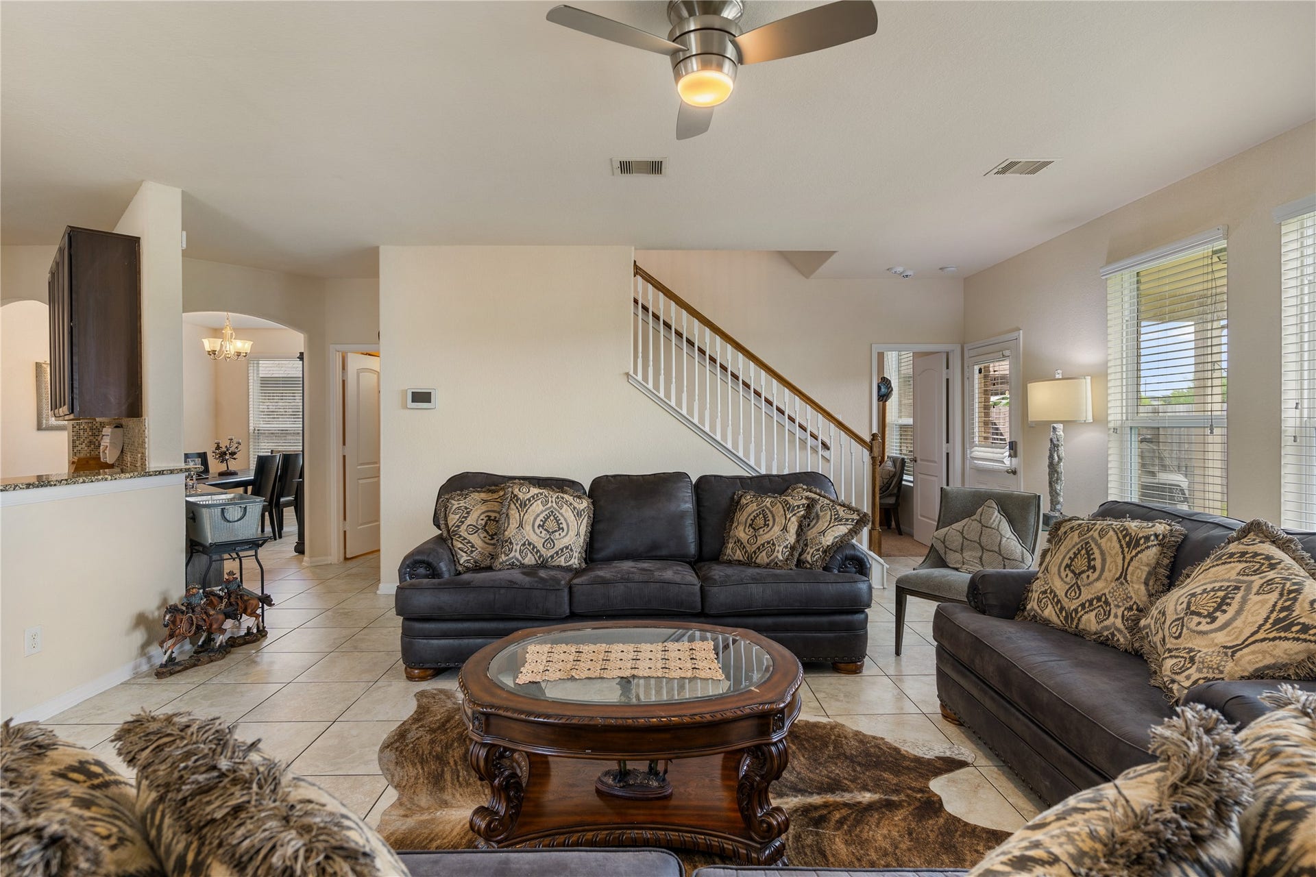 3330 Cabin Wood Way, Houston, TX 77084 A peek in to the kitchen and formal dining on the left. On the right you will have a nice guest bedroom down stairs.