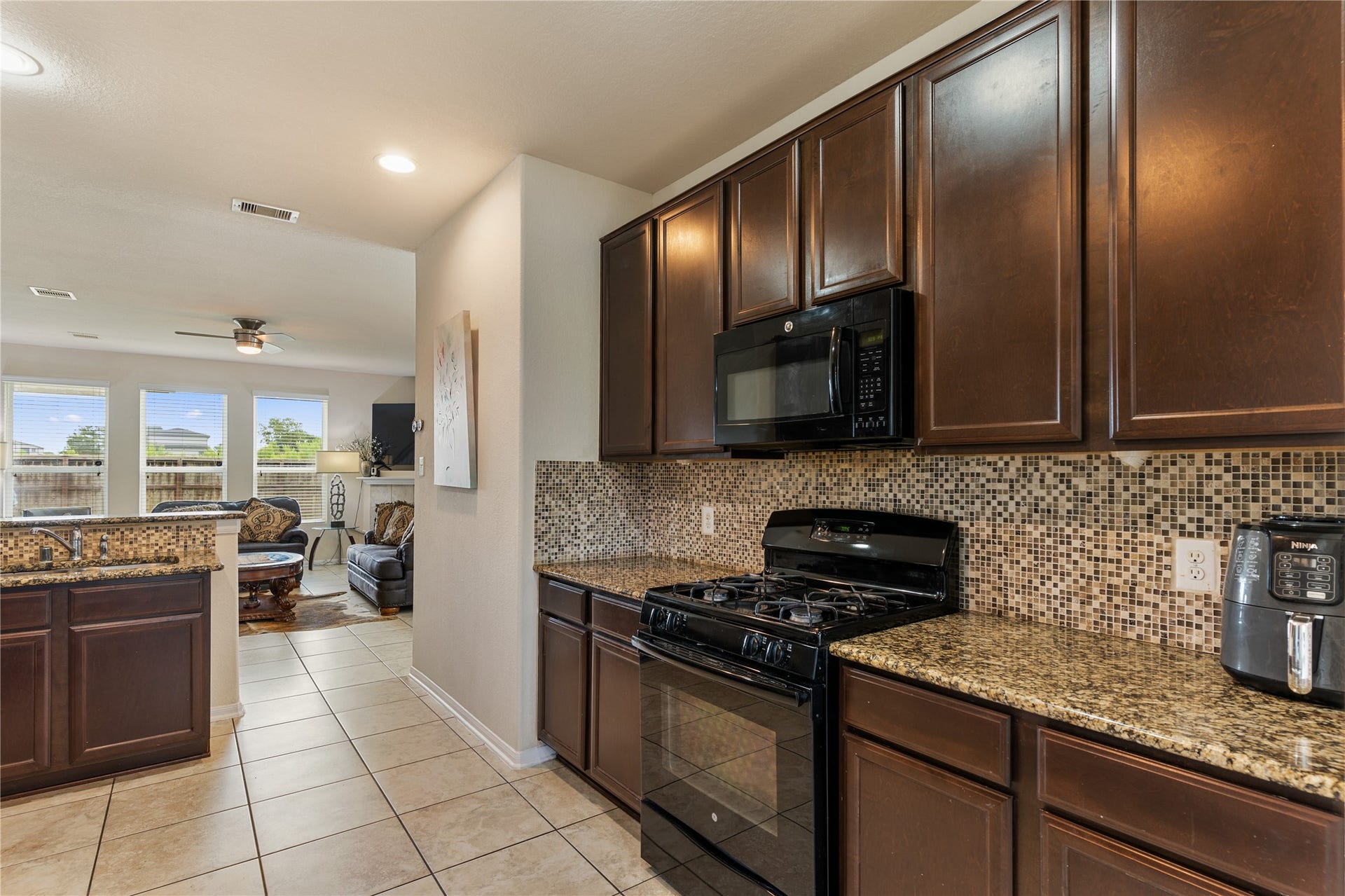 3330 Cabin Wood Way, Houston, TX 77084 Tons of storage with these cabinets. Check out that beautiful modern backsplash.