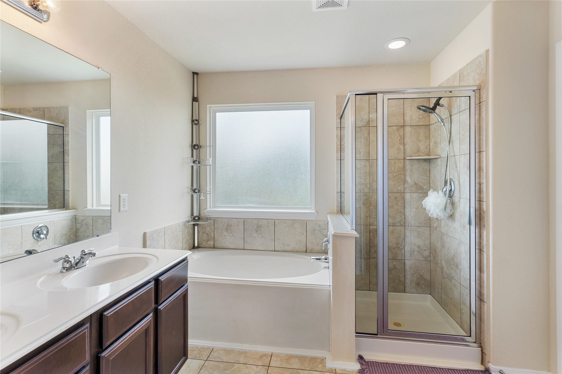 3330 Cabin Wood Way, Houston, TX 77084 Nice large tub and stand alone shower in this primary bathroom.