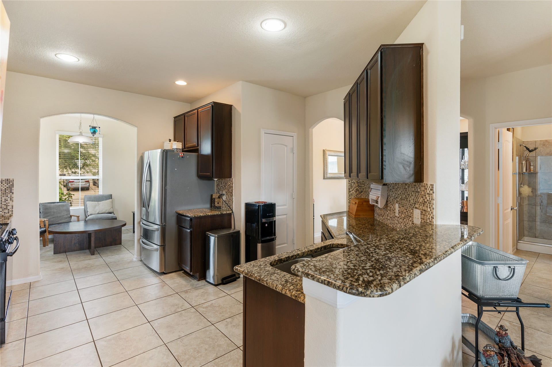 3330 Cabin Wood Way, Houston, TX 77084 Notice a space for a couple bar stool seating from the living room to kitchen.