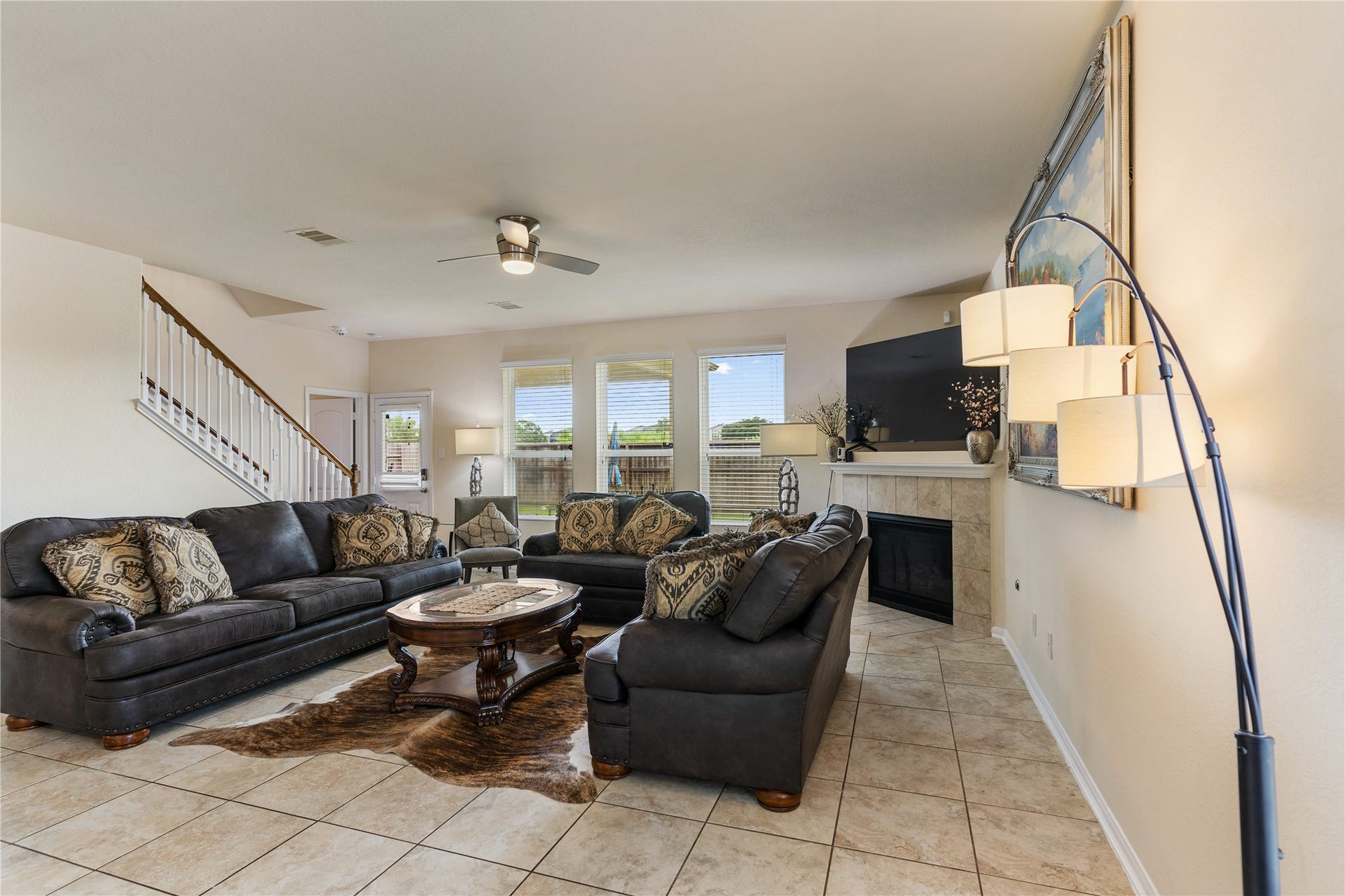 3330 Cabin Wood Way, Houston, TX 77084 Welcome home. This large living room features tile flooring, tons of natural light and a large fireplace.