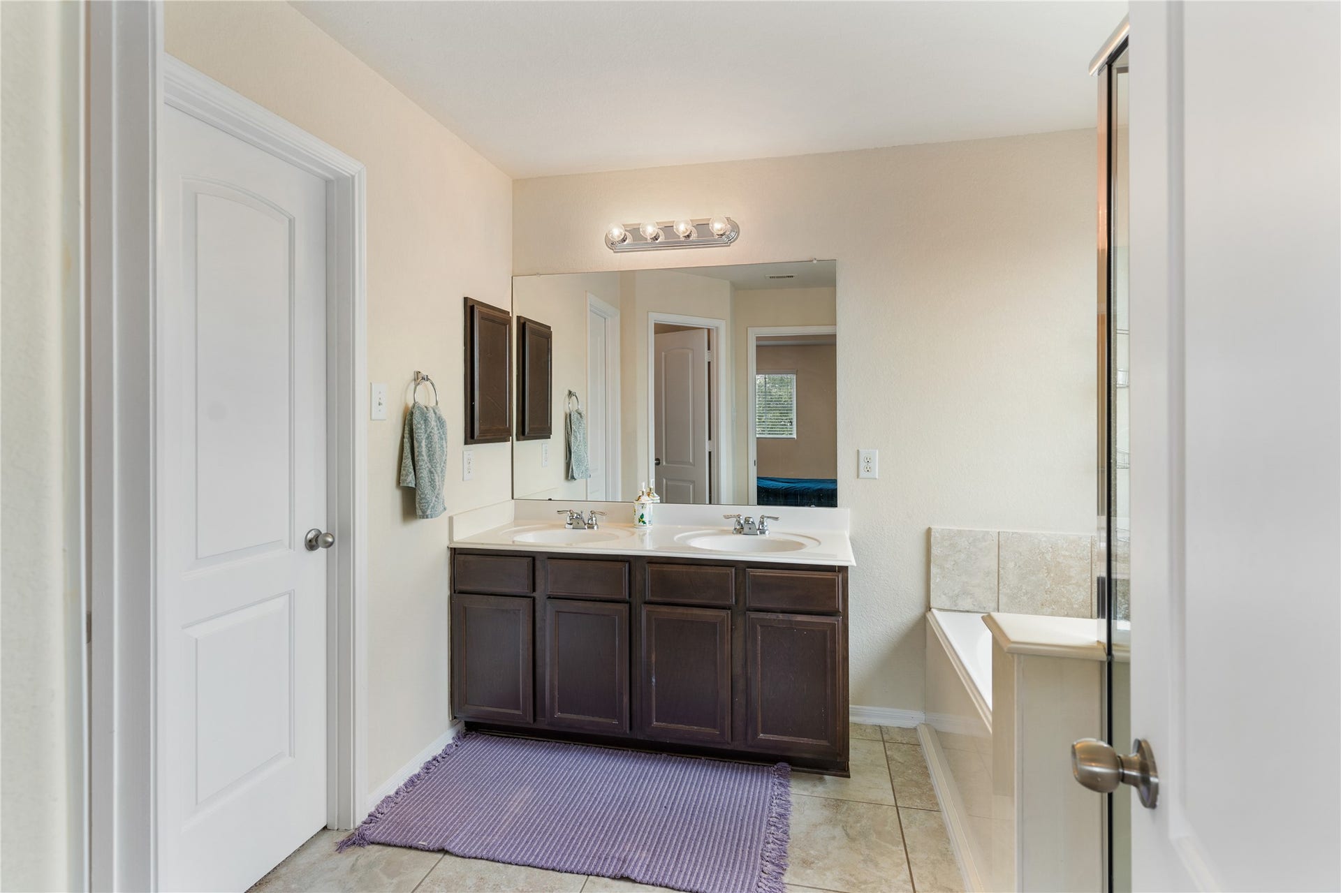 3330 Cabin Wood Way, Houston, TX 77084 Two sinks in this primary en-suite bathroom.