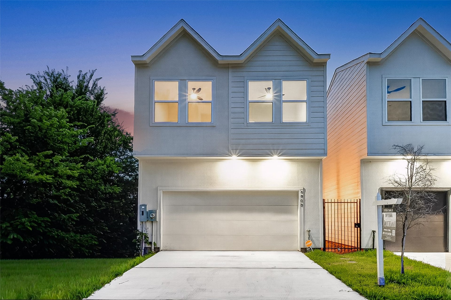 6808 Madrid Street, Houston, TX 77021 Modern two-story home with a double gable roof, featuring a sleek facade and a two-car garage. The exterior is well-lit, and the property includes a small lawn area. Perfect for contemporary living.Welcome to 6808 Madrid
