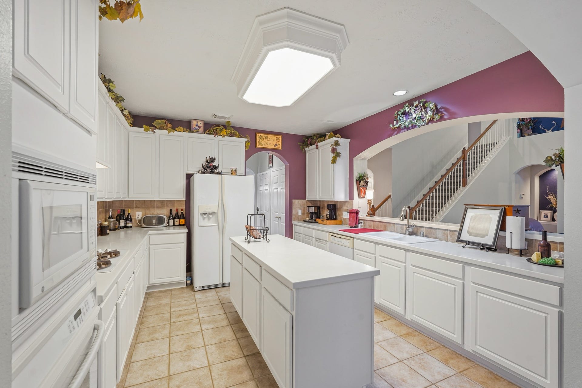 Light & Bright Kitchen open to the Family Room.