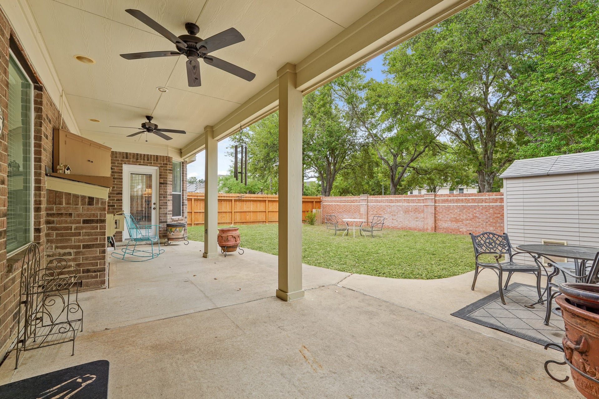 Covered Back Patio overlooking the large backyard.