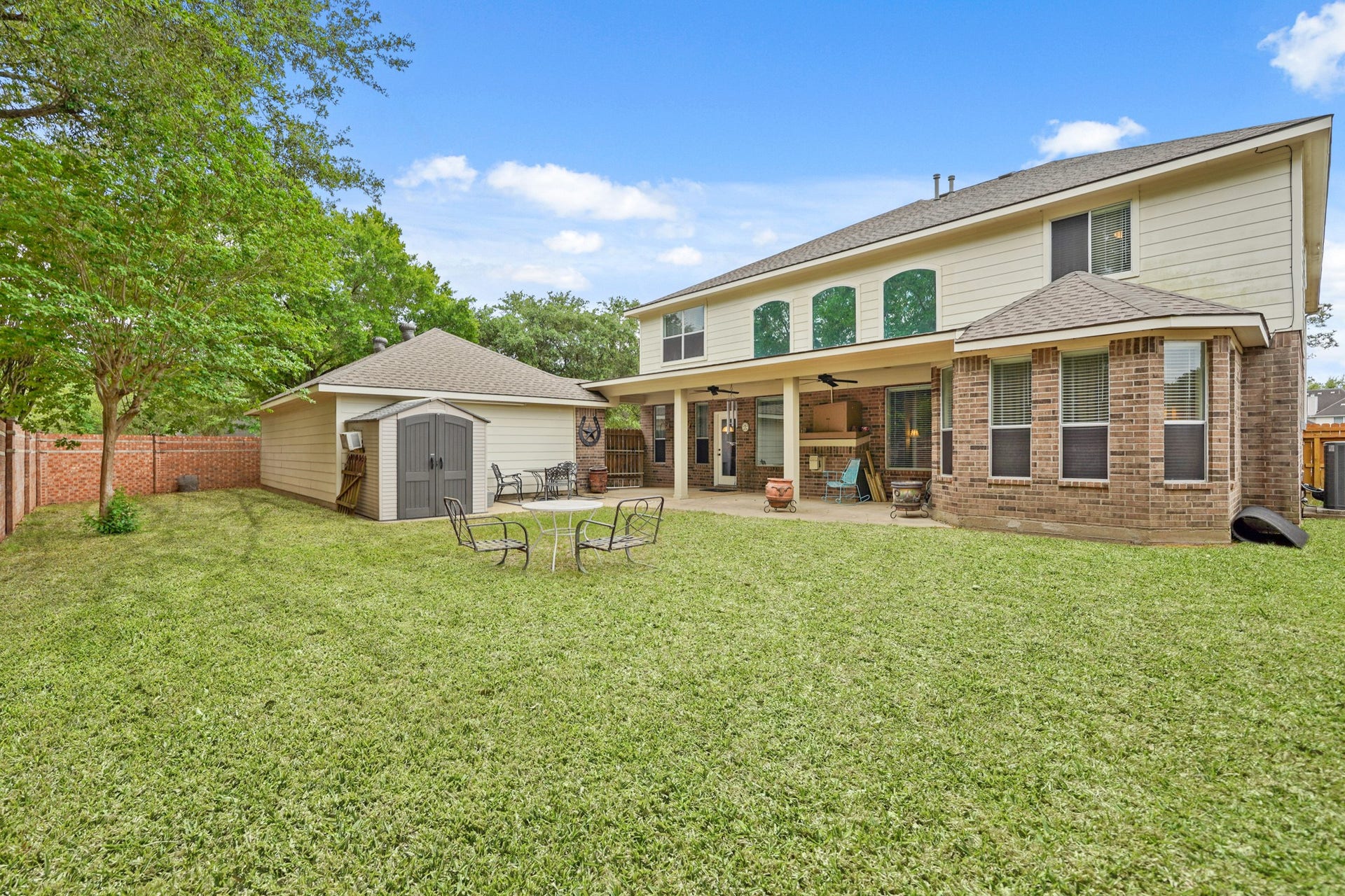 Spacious Back Yard and view of the covered patio.