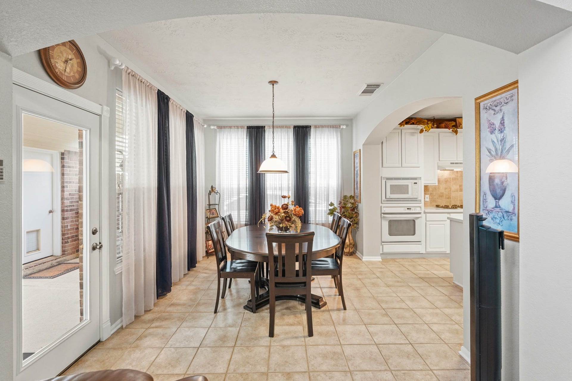 Breakfast Room is open to the Kitchen. Window coverings and tile floors.