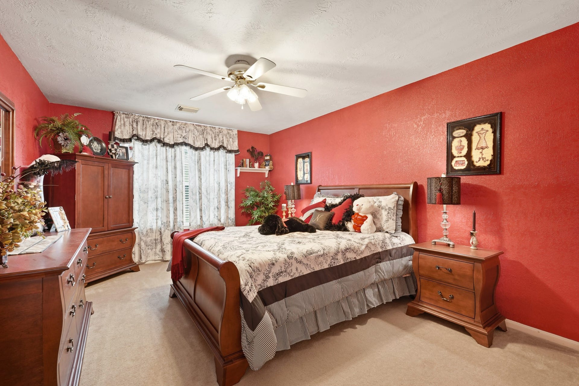 Large secondary with views of the mature trees and a walk-in closet.