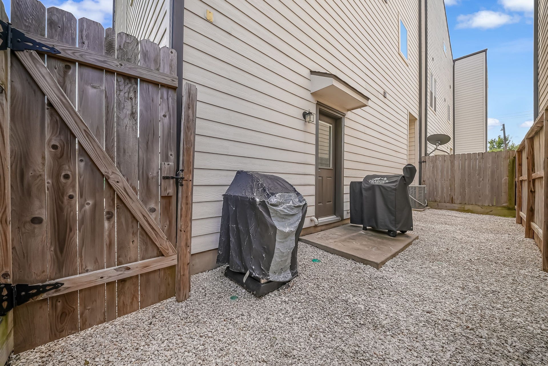 5916 Petty Street, #A, Houston, TX 77007 Low-maintenance backyard with gravel landscaping and space for outdoor dining or grilling.