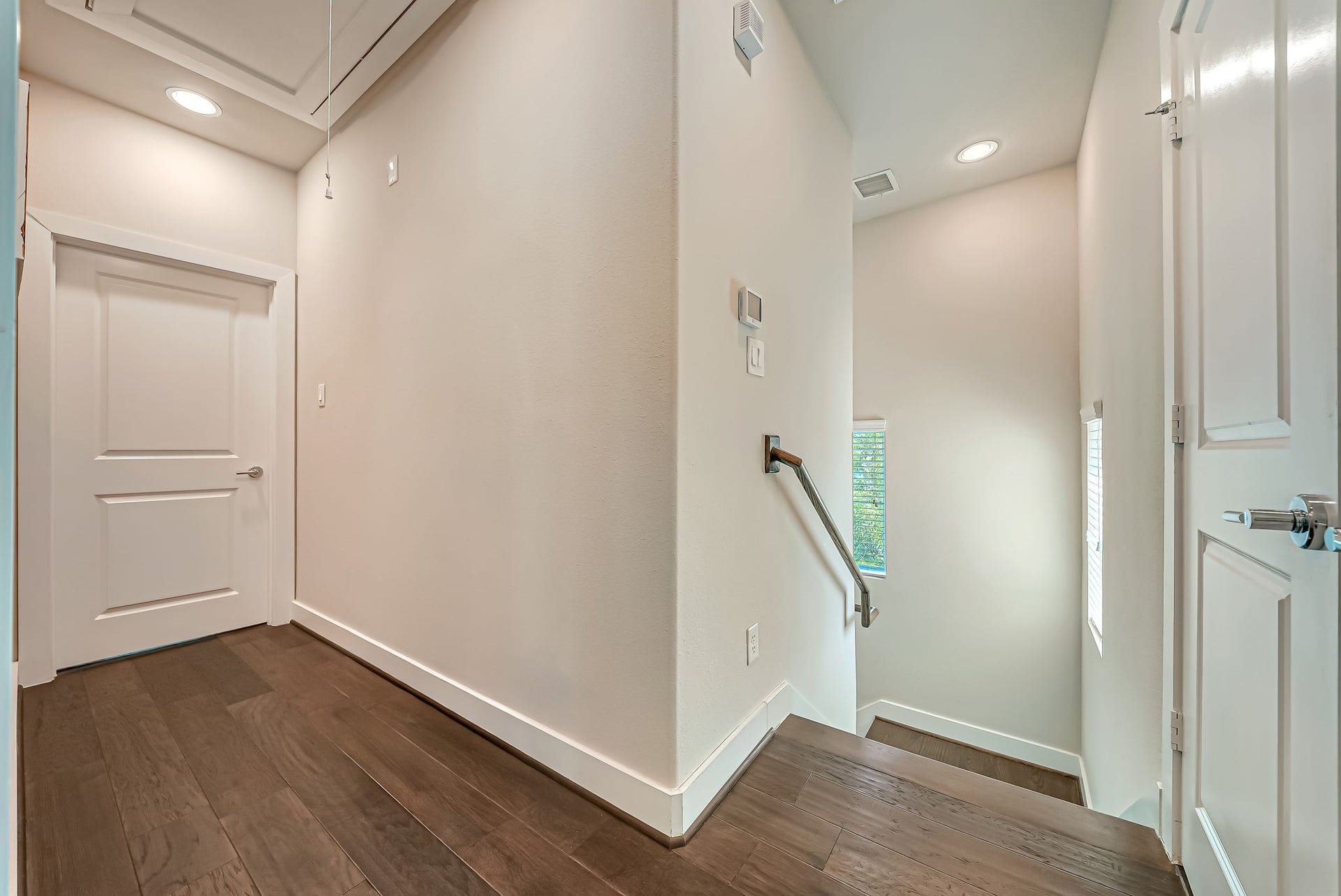 5916 Petty Street, #A, Houston, TX 77007 Interior stairway connecting all levels with architectural detailing and natural light.