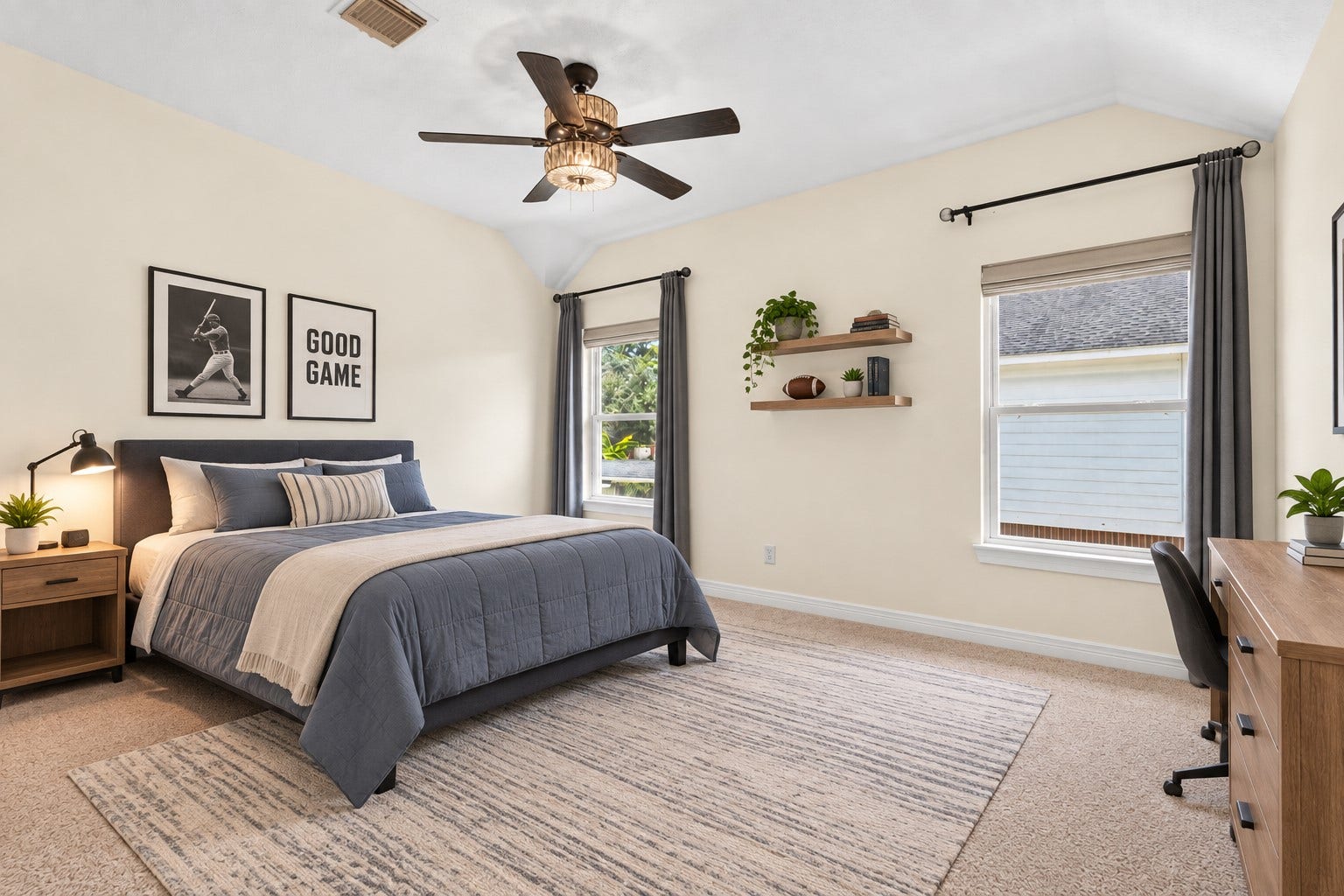 Upstairs bedroom with vaulted ceiling, natural light and the added privacy of its own ENSUITE BATH.