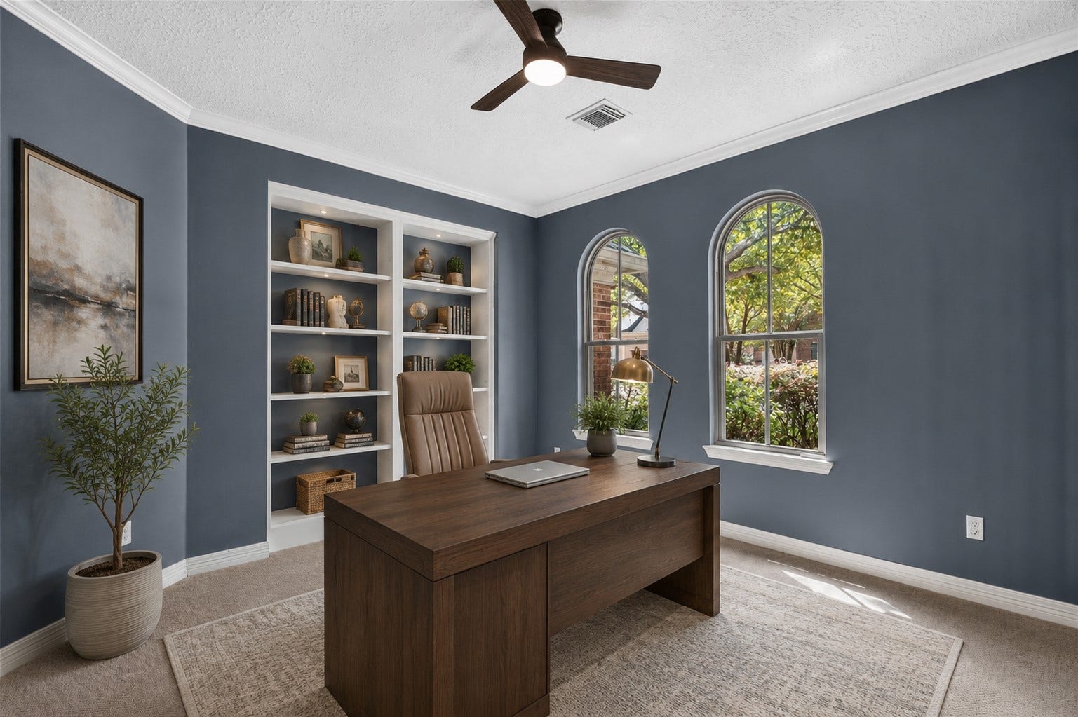 Study virtually staged to showcase the built-in shelving and possibilities for a private home office.