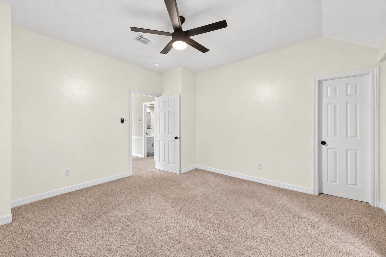 Spacious upstairs bedroom with a flexible layout and plenty of room for furniture placement.