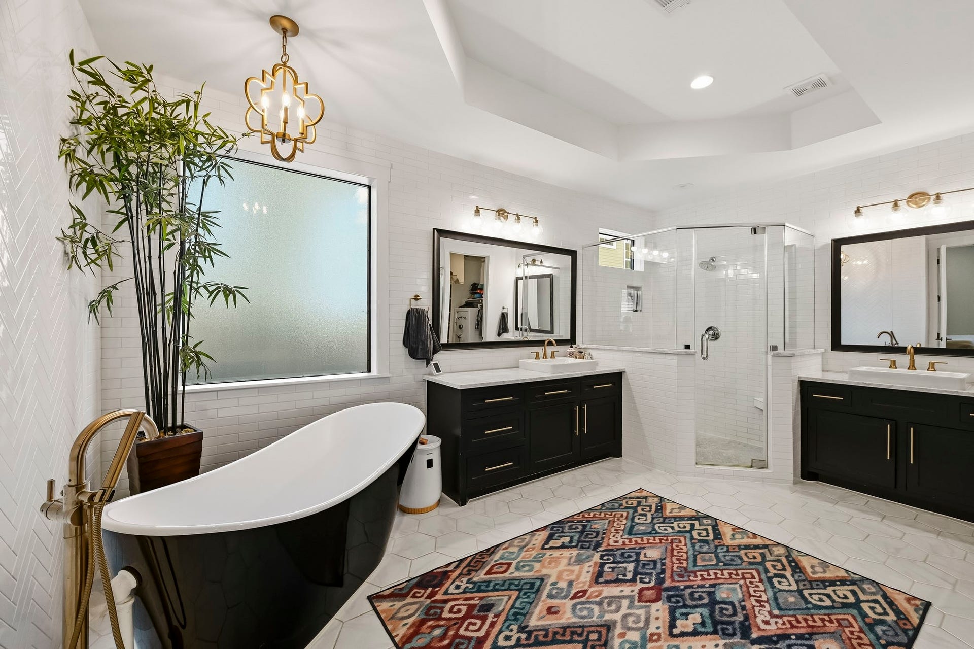 Primary ensuite with his & hers closets, dual sinks and soaking tub with separate shower.