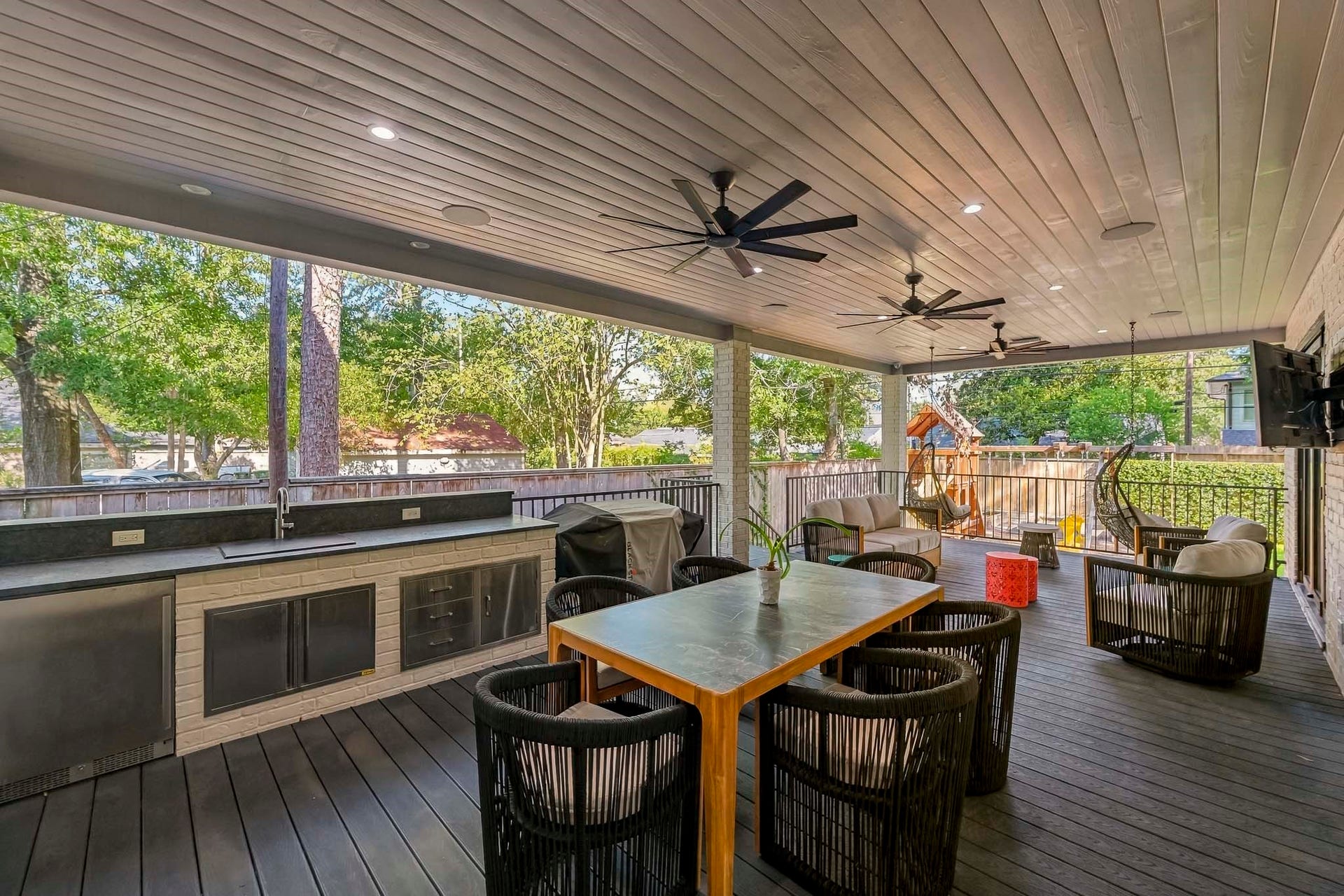 Extended deck includes outdoor kitchen, multiple ceiling fans & electrical wiring