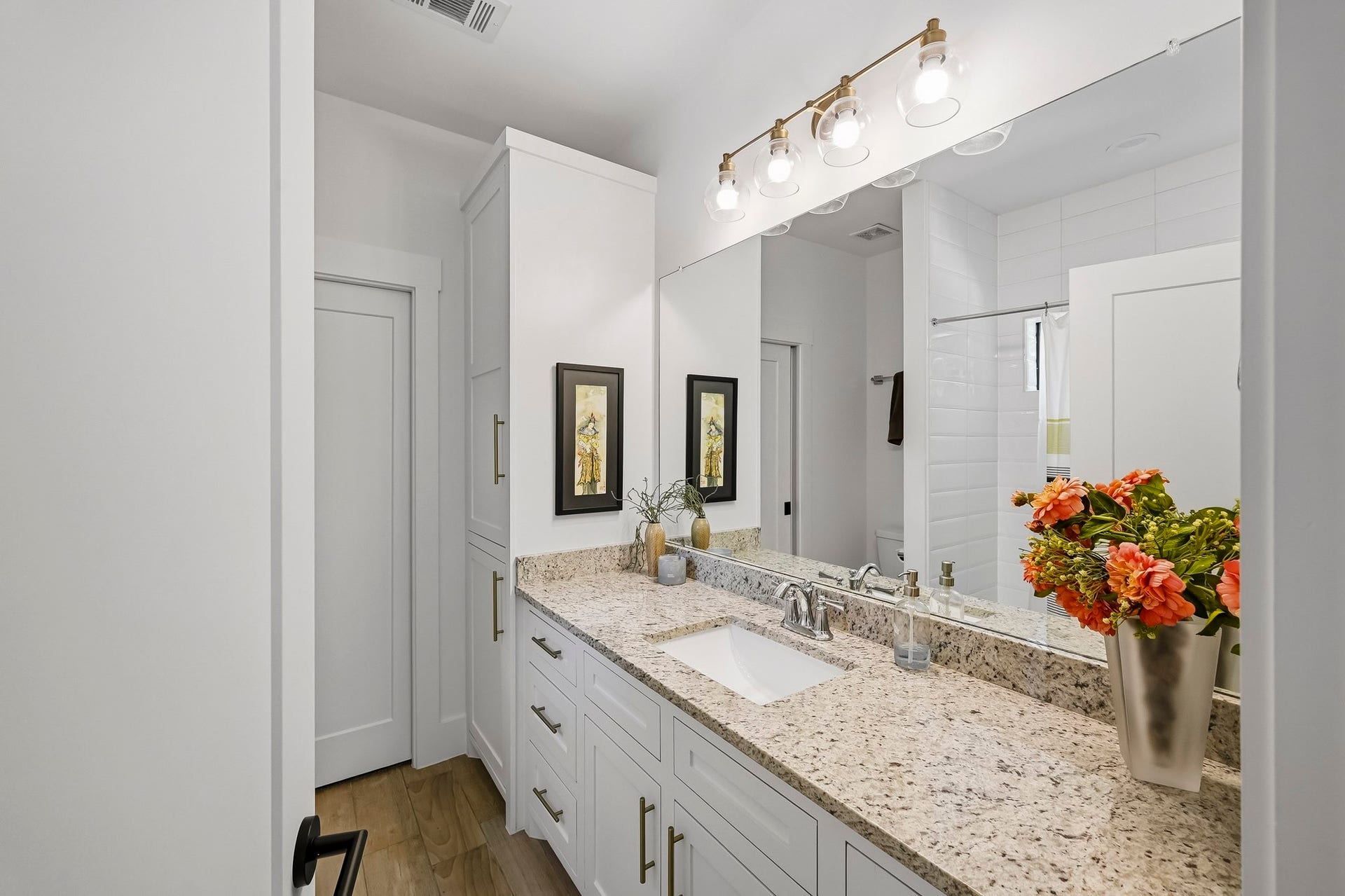 Private ensuite leading into a spacious walk-in closet from in the secondary bedroom 3