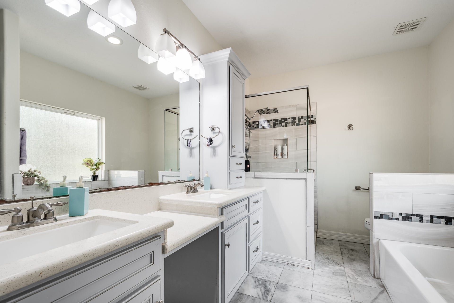 305 Hill Brook Lane, Conroe, TX 77385 Primary bath with double sinks, a vanity, and separate tub and shower.