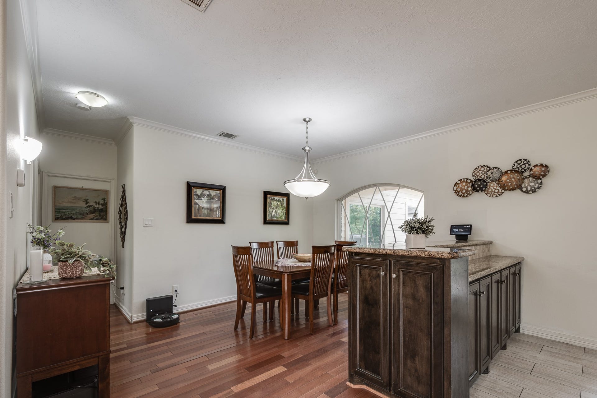 305 Hill Brook Lane, Conroe, TX 77385 Dining area with table for 6 but could be for 10. With breakfast bar.