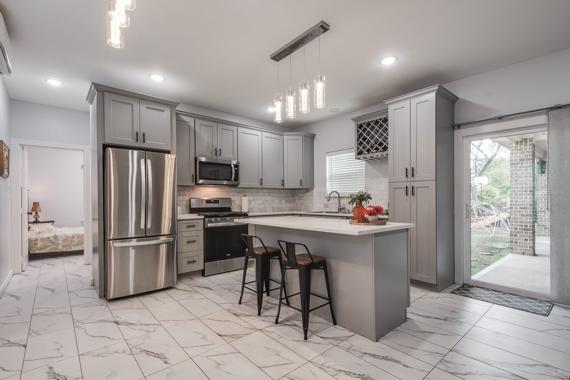 305 Hill Brook Lane, Conroe, TX 77385 Full second kitchen with quartz countertops and recess lighting.