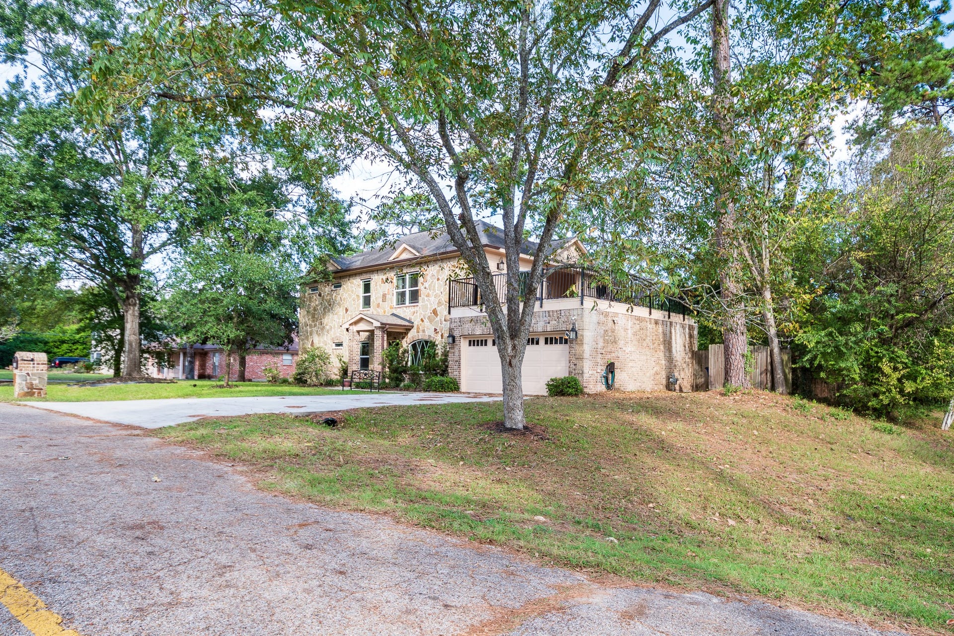 305 Hill Brook Lane, Conroe, TX 77385 Oversized corner lot with great elevation!