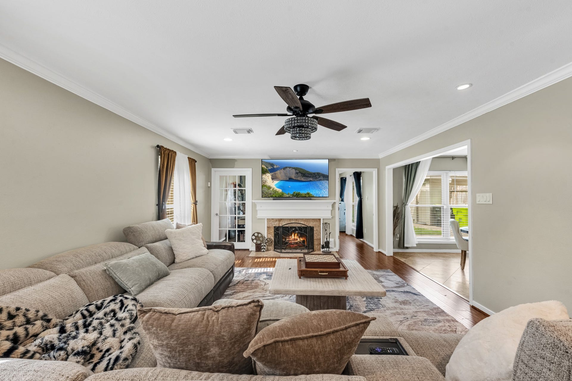 3514 Corbett Court, Missouri City, TX 77459 The family room offers an inviting, oversized layout centered around a beautiful fireplace, creating the perfect space for relaxing evenings or gathering with family and friends.