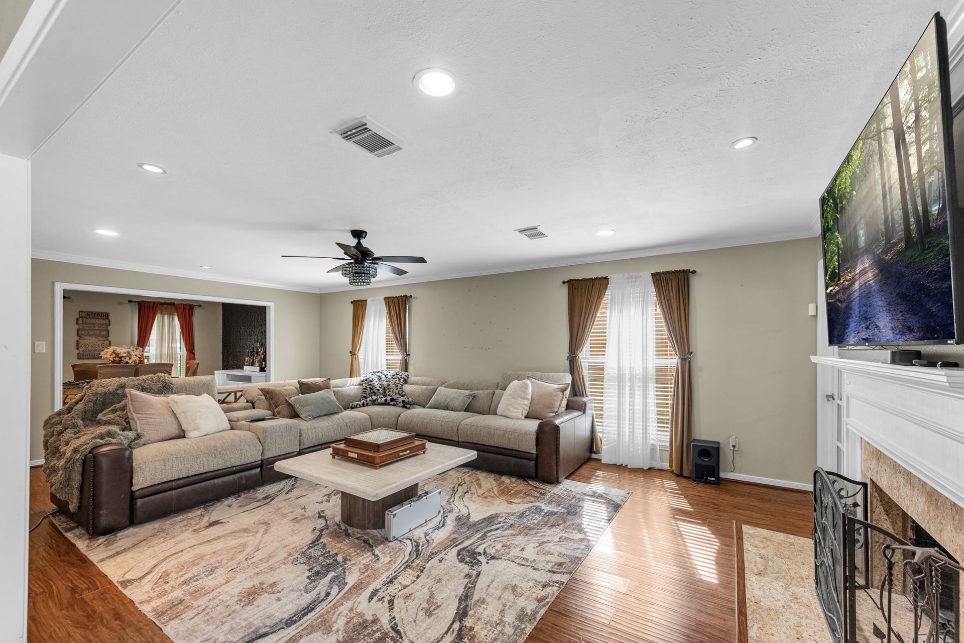 3514 Corbett Court, Missouri City, TX 77459 The family room offers an inviting, oversized layout centered around a beautiful fireplace, creating the perfect space for relaxing evenings or gathering with family and friends.