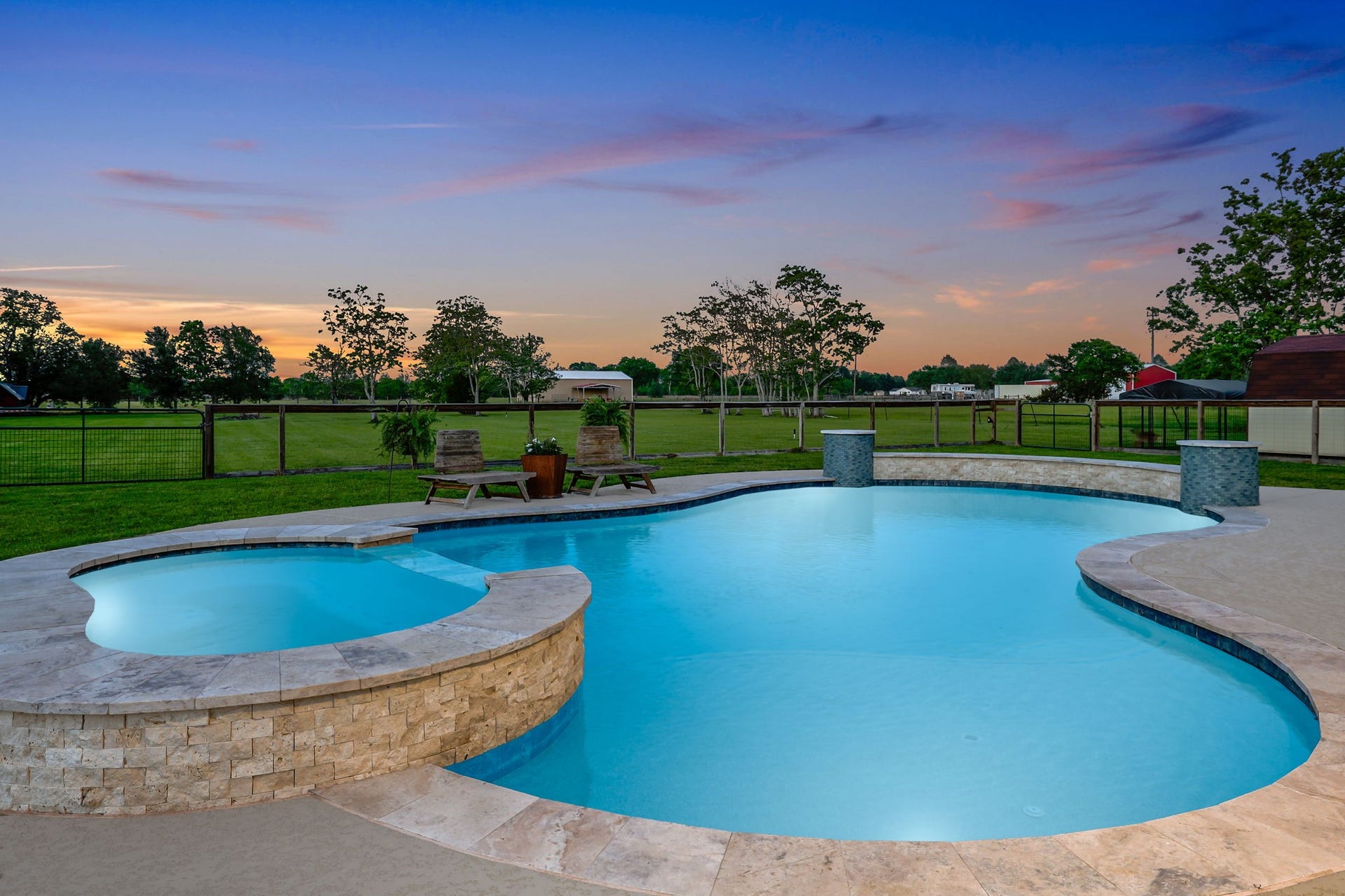 12751 County Road 283, Alvin, TX 77511 Dive into luxury with a stunning poolside view of the breathtaking Texas sunset, promising unforgettable evenings.