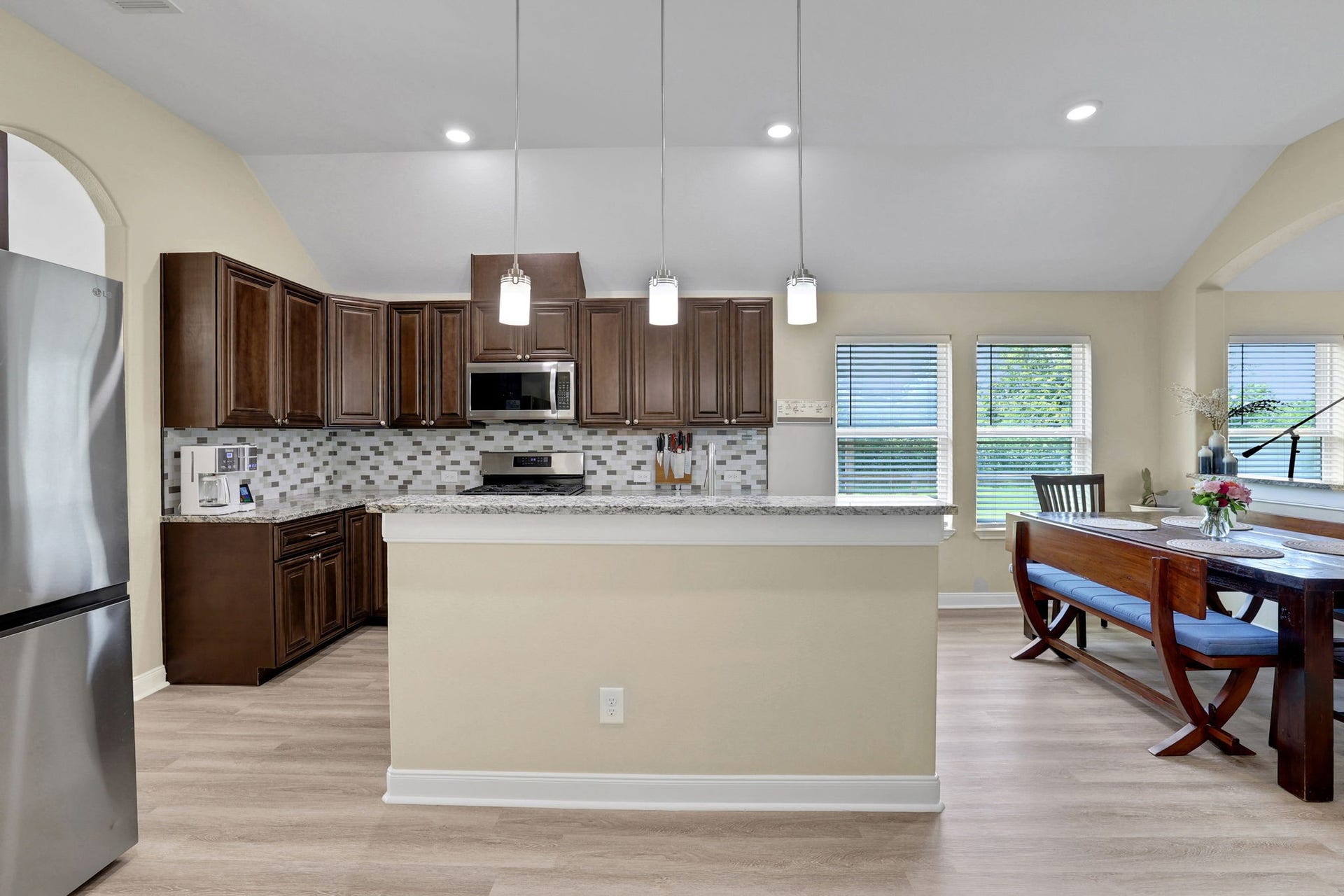 12751 County Road 283, Alvin, TX 77511 The kitchen offers a breakfast bar for convenience