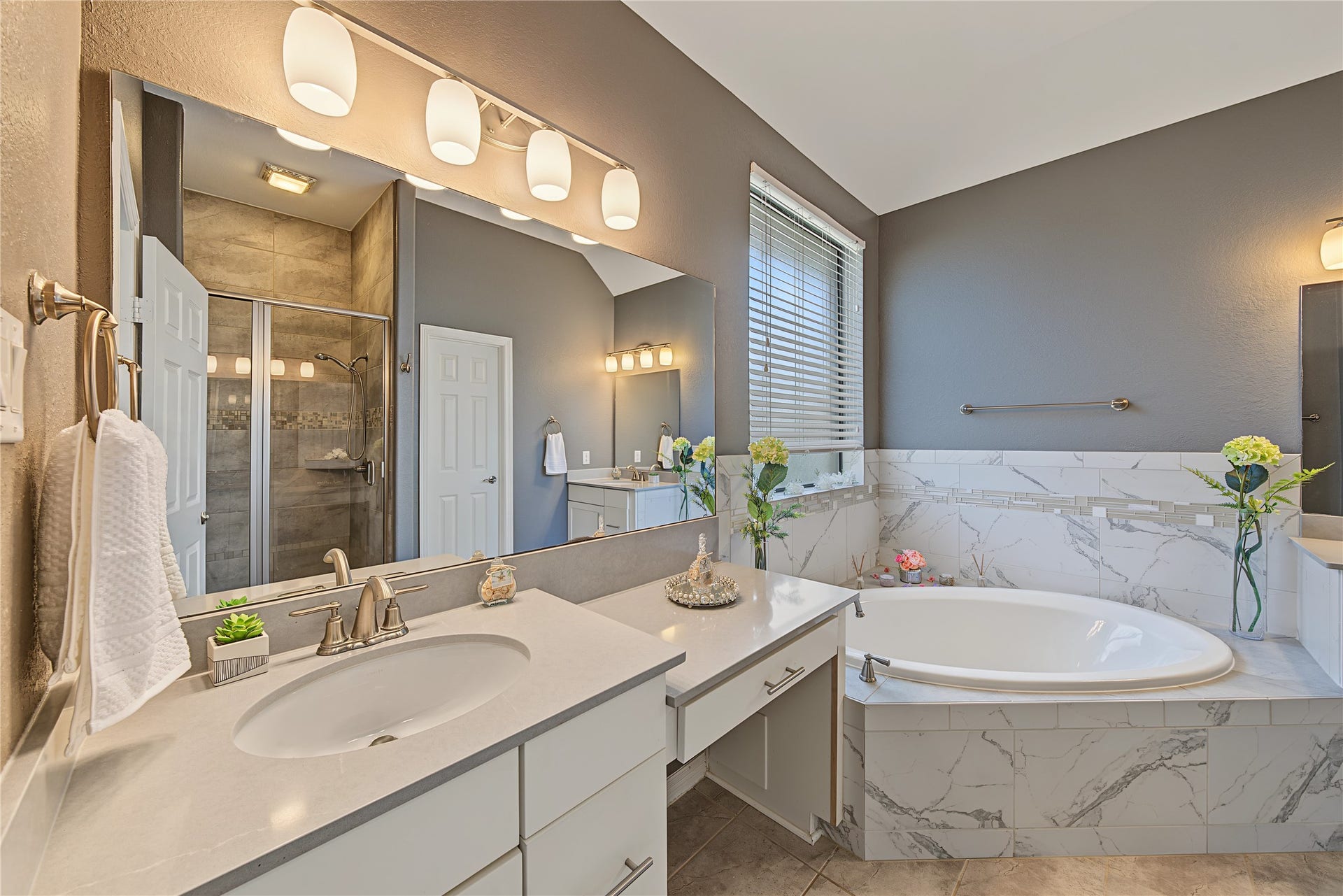 6723 Sotoria Lane, Sugar Land, TX 77479 primary bathroom with dual vanities and a separate tub/walk in shower