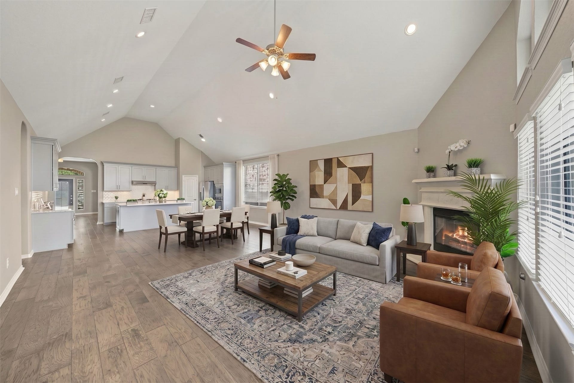 6723 Sotoria Lane, Sugar Land, TX 77479 virtual staged: a spacious family room with a stone fireplace framed by a dramatic wall of custom geometric windows
