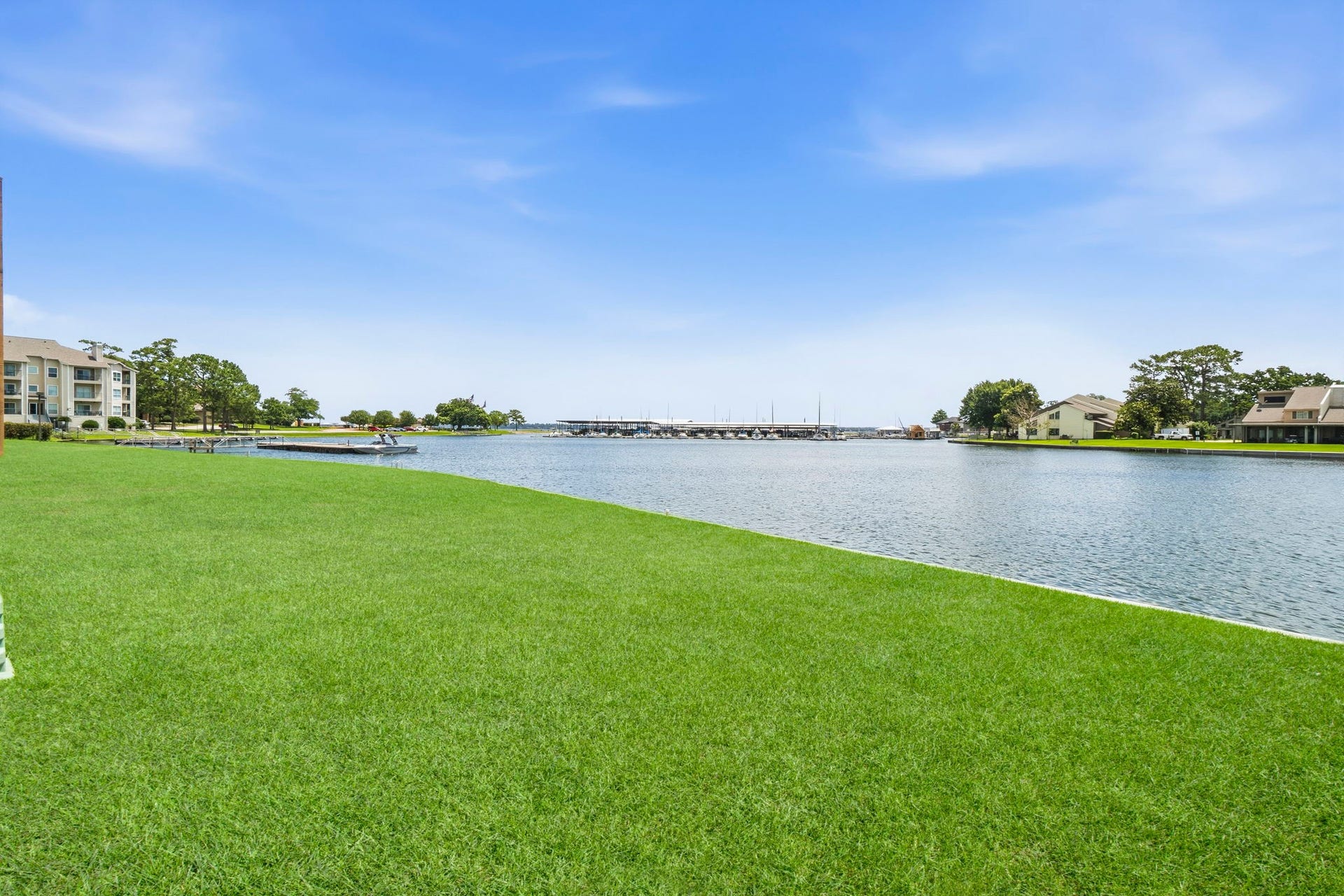 Wide-open water views and beautifully maintained grounds create a peaceful atmosphere that feels like a year-round vacation.