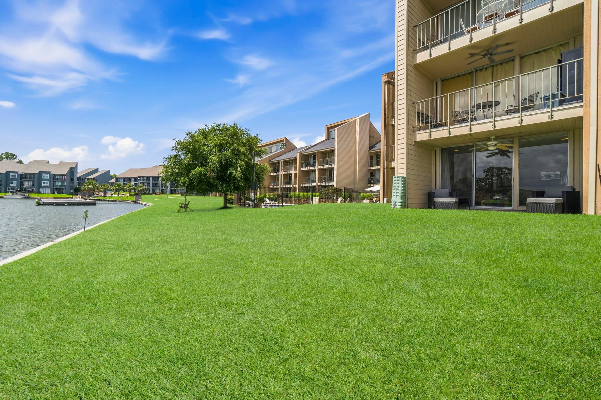 Enjoy easy access from your private patio directly to the beautifully maintained grounds and waterfront common area.
