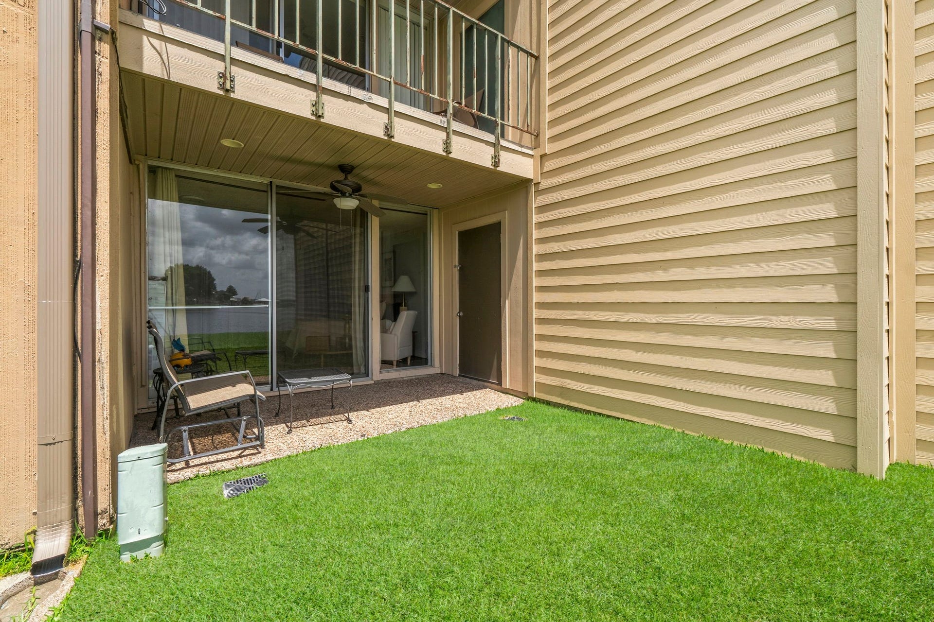 This covered patio offers the perfect blend of comfort and convenience, creating an ideal spot to enjoy fresh air, lake breezes, and peaceful surroundings year-round.