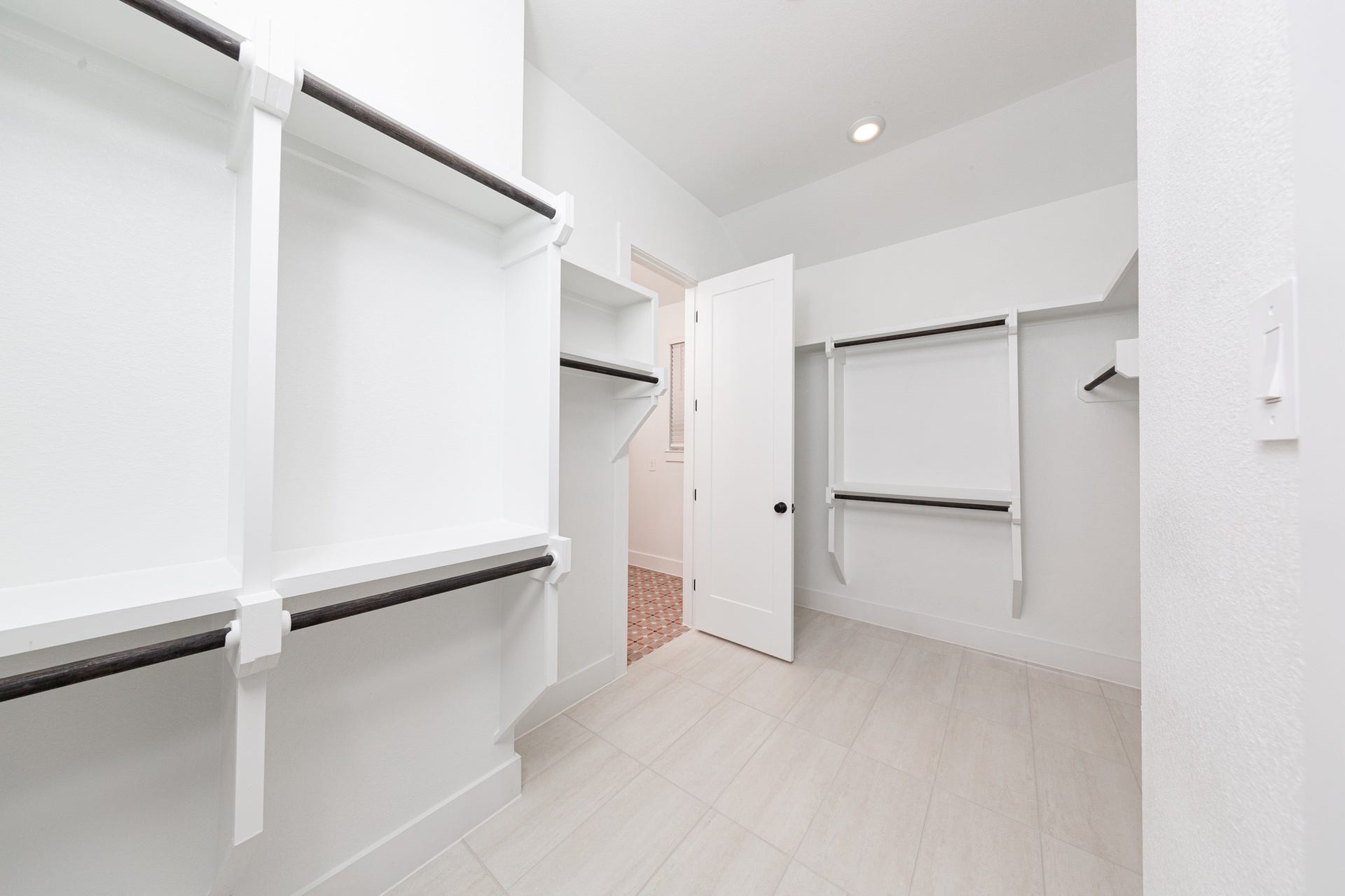 41418 Threadgill Way, Montgomery, TX 77316 Look at this immaculate closet! With high shelving, multiple rows to hang clothing, you are sure to have enough room for all your belongings! This closet also features a convenient access door directly into the laundry room.