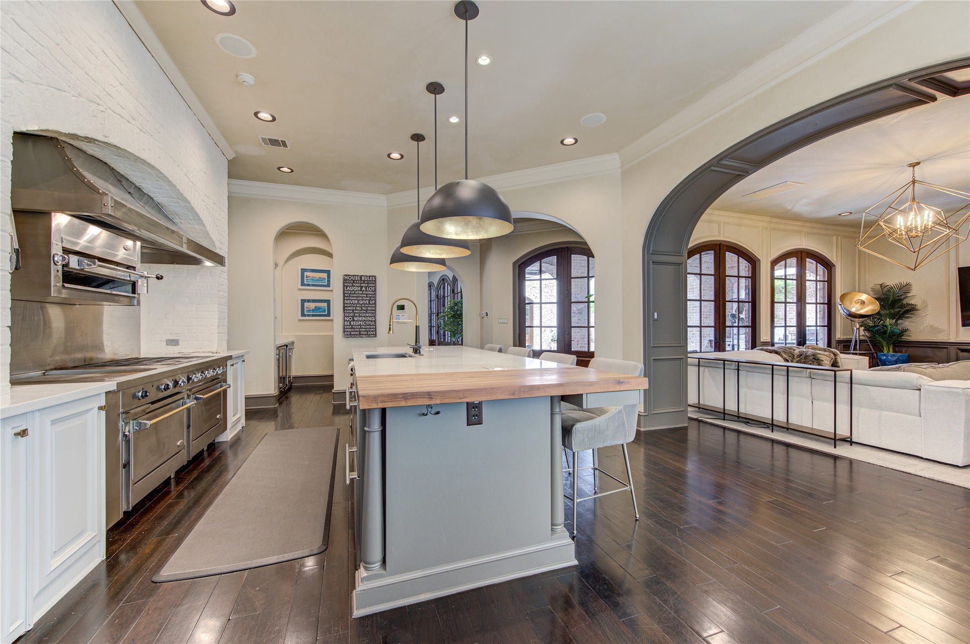 5110 W Oak Mews, Houston, TX 77056 A true chef's kitchen, this exceptional culinary space is anchored by a professional-grade gas range with an integrated broiler, offering the performance serious cooks demand. Surrounded by custom cabinetry, premium finishes, and expansive prep space, every detail has been thoughtfully designed to inspire gourmet meals, effortless entertaining, and unforgettable gatherings.