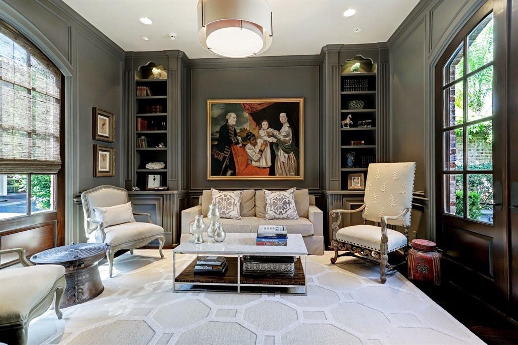5110 W Oak Mews, Houston, TX 77056 The distinguished study blends timeless craftsmanship with modern sophistication, featuring rich wood paneling finished in a stylish designer paint color. An ideal executive retreat, this refined space offers warmth, character, and an inspiring setting for working from home, reading, or quiet reflection.