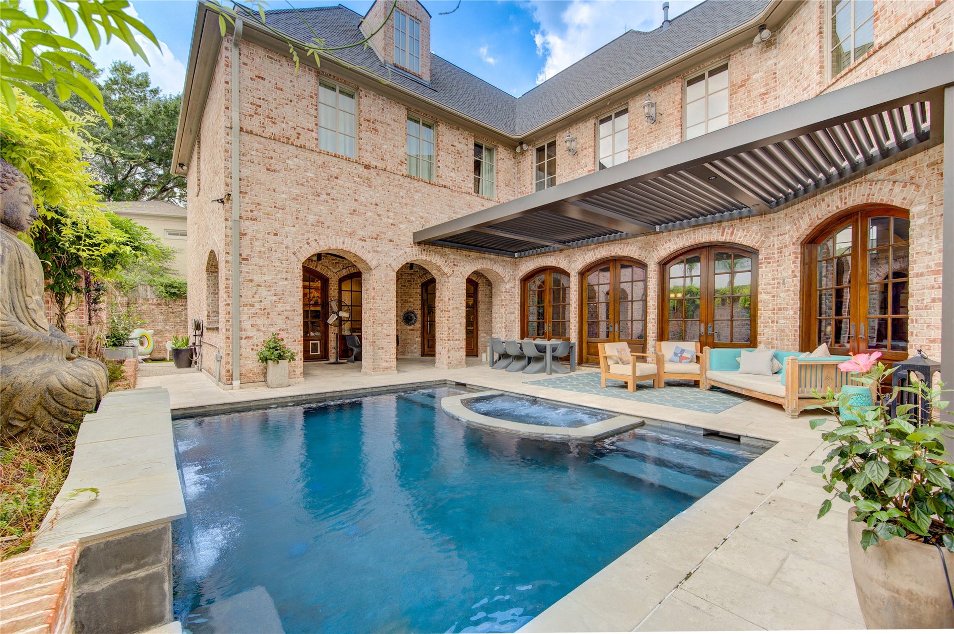 5110 W Oak Mews, Houston, TX 77056 This home is designed for entertaining inside and out with an attention to detail in the private swimming pool and Lanai with a remote controlled metal cover that can be opened and closed.
