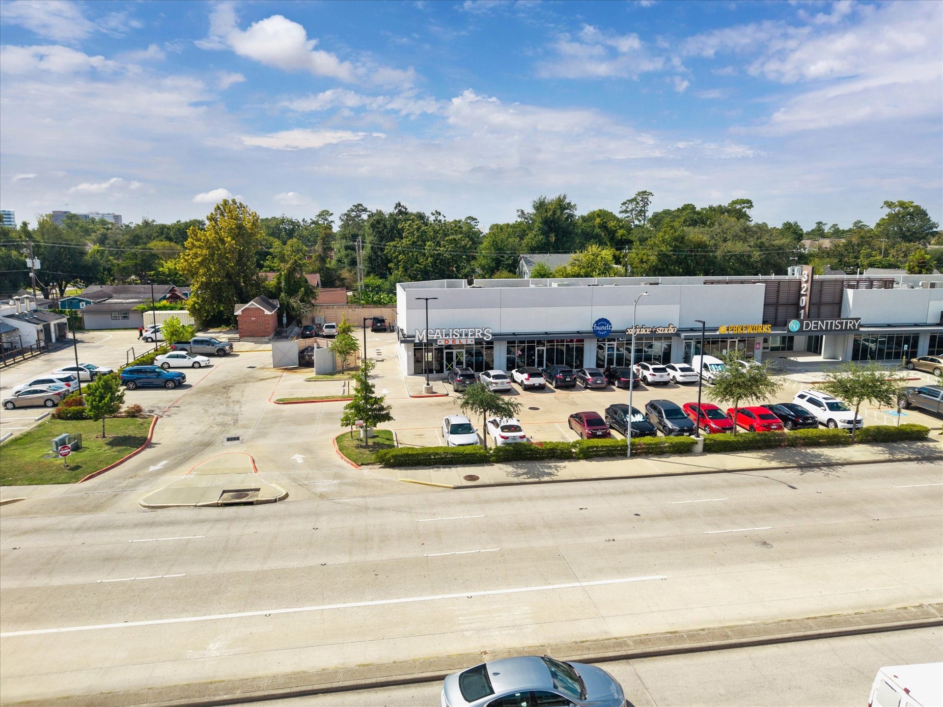 A vibrant commercial hub featuring a variety of dining and retail options, from McAlisters Deli to local favorites. Wide sidewalks, ample parking, and high visibility attract consistent visitors throughout the day, creating a lively setting that blends convenience with community energy.